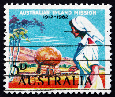 AUSTRALIA - CIRCA 1962: a stamp shows Nurse and Rev. Flynn’s Grave, 50th Anniversary of Founding of the Inland Mission by Rev. John Flynn